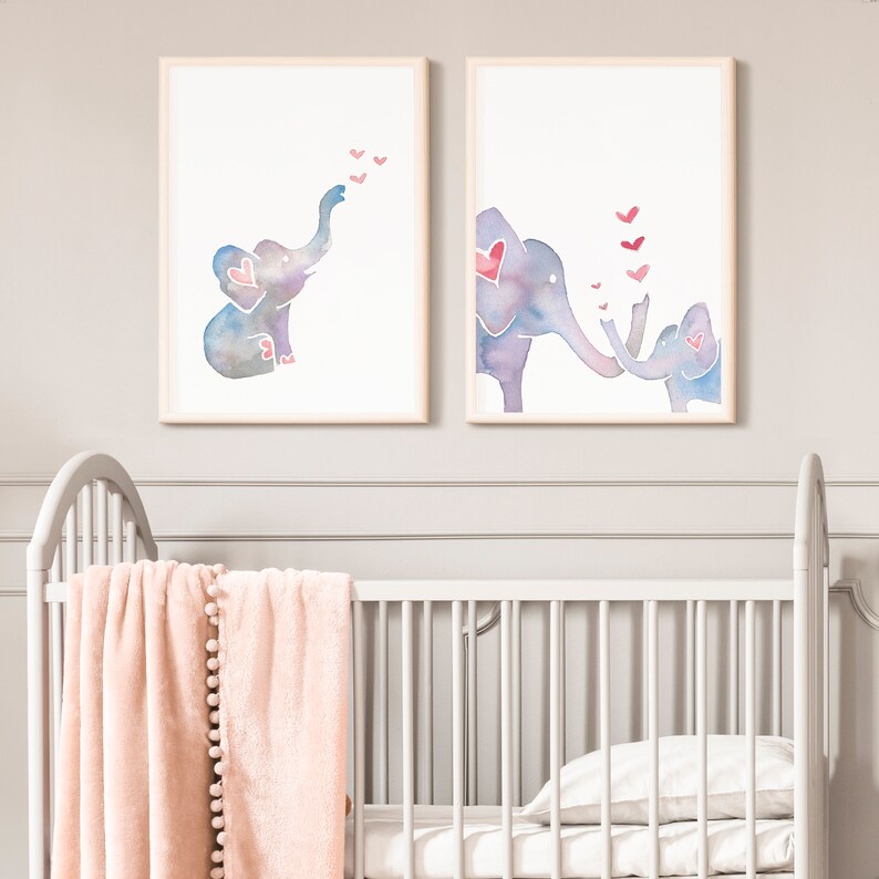 May include: Two watercolor paintings of elephants with hearts. The first painting shows a single elephant blowing hearts into the air. The second painting shows two elephants, one larger than the other, touching trunks with hearts floating between them.