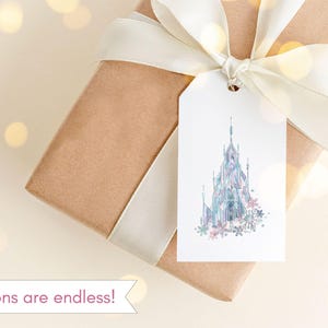 May include: A gift wrapped in brown paper with a white satin ribbon and bow. A white tag with a watercolor illustration of a castle and flowers is attached to the ribbon. The text "Options are endless!" is at the bottom.