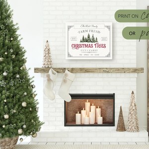 May include: A white sign with a red and green Christmas tree design. The sign reads "The Red Family Farm Fresh Christmas Trees Cut Carry Pine Spruce Fir Cedar". The sign is displayed on a white brick fireplace mantel with a lit fireplace below.
