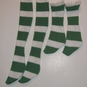 May include: Four pairs of striped knee-high socks. Two pairs are green and white with gold trim at the top. Two pairs are green and white with white lace trim at the top.
