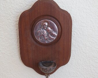 French Antique Bénitier Holy Water Font on Wood with First Holy Communion Medallion. Communicant leans on Jesus&#39; Breast Host Bread and Wine