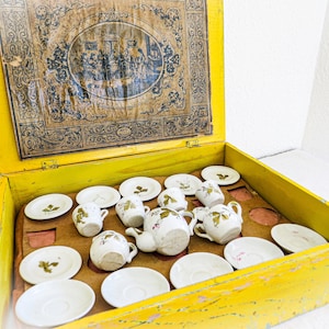 Antique Doll Dishes from Germany in Original Presentation Box. 5 saucers, 4 tea cups, 6 plates, Tea or Coffee Pot, Sugar Bowl, Cream Pitcher