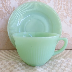 Vintage Jadeite Jane Ray Cup and Saucer. Fire-King by Anchor Hocking. Produced from 1945-1975. Ribbed Design Saucer and Cup.Green Milk Glass