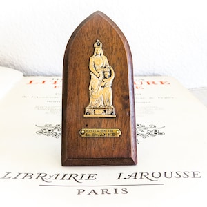 St. Anne Plaque, Souvenir of Saint Anne from France. Brass Engraved metal image of St Anne affixed to wood plaque with easel back. Crowned.