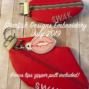May include: Two red lips-shaped zipper pouches with a zipper closure. The pouches have white embroidery that says "SWAK". The smaller pouch has a key ring attached. The larger pouch has a bonus lips zipper pull.