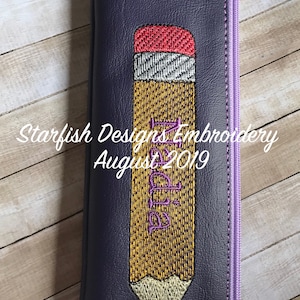 May include: Purple zippered pouch with a pencil design embroidered on the front. The pencil is yellow with a red eraser and the word "Pencil" is embroidered in purple on the pencil. The text "Starfish Designs Embroidery August 2019" is embroidered on the pouch.
