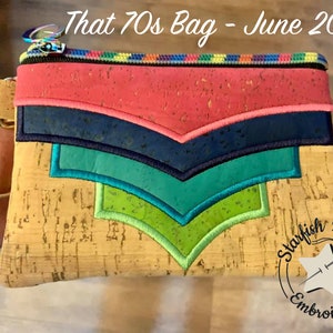 May include: A small cork fabric bag with a zipper closure and a rainbow-colored zipper pull. The bag has a colorful embroidered design with a chevron pattern in shades of pink, blue, green, and teal. The bag is labeled "Starfish Designs Embroidery" in a circle.