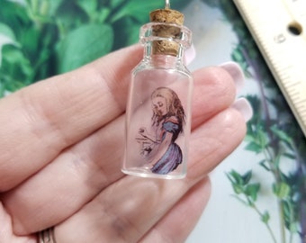 glass bottle pendant with alice in wonderland image