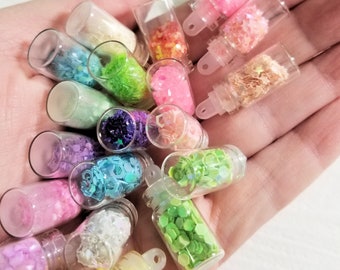 28 clear glass vial bottles with fairy dust many different king of glitters