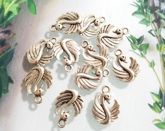 14  swan  charms finding