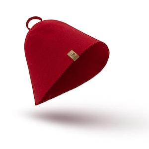 Könnte beinhalten: Ein roter Filzhut mit einem kleinen braunen Etikett mit der Aufschrift "Goodfel"
