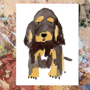 May include: Watercolor illustration of a dog with brown and tan fur, sitting upright. The dog has long ears and a black nose. The artwork is on a white background, with a wooden surface visible in the background.