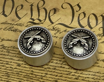 Cross pistol guitar knobs.