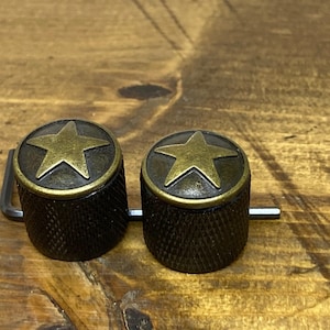 Manopole a stella in ottone zigrinato nero