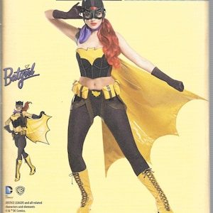 May include: A Simplicity sewing pattern featuring a Batgirl costume from DC Comics Bombshells. The costume includes a black and yellow bodice, leggings, gloves, boots, and a cape. The pattern size is U.S. 14-22.