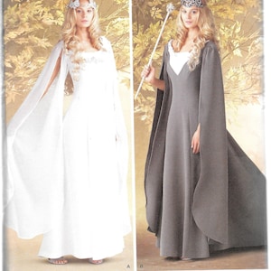 May include: A sewing pattern for a long, flowing gown with a cape. The pattern includes two variations: one with a white gown and one with a gray gown. Both gowns feature a V-neckline and a fitted bodice. The cape is long and flowing, with a rounded hemline. The pattern is for sizes 6-16.