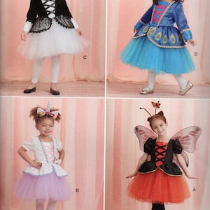 May include: Four girls wearing different costumes. The girl on the left is wearing a white tutu with a black lace top and a black velvet jacket. The girl in the middle is wearing a lavender tutu with a white top and a unicorn headband. The girl on the right is wearing an orange tutu with a black top and butterfly wings. The girl in the back is wearing a blue tutu with a blue top and a peacock design. Headband accessories and wings are not included.