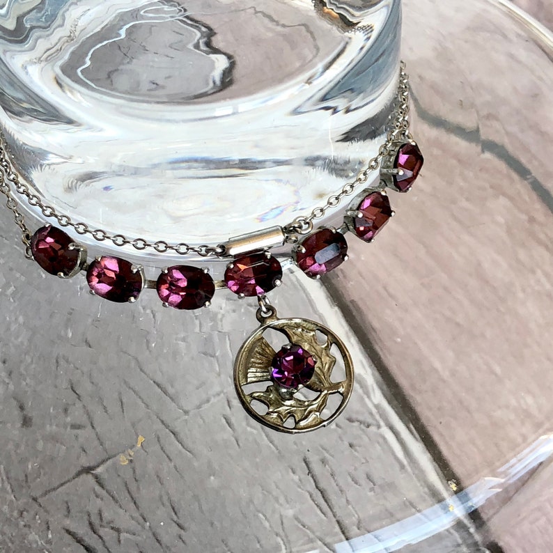 Silver tone /& amethyst colour necklace.