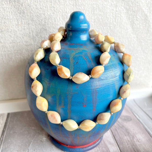 Neutral marble plastic necklace.