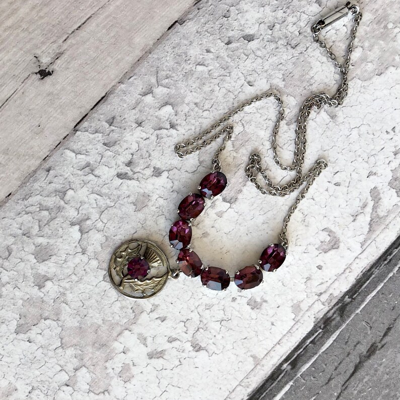 Silver tone /& amethyst colour necklace.