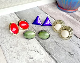 4 pairs of gold & silver tone clip on earrings.