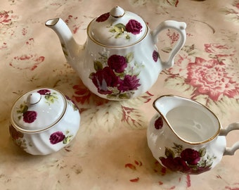 Vintage Royal Paine bone china child teapot sugar and creamer set