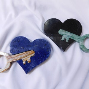 Hand carved heart with a key mixed mineral carvings