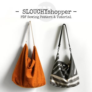 Może przedstawiać: Dwie  luźne  torby  na  ramię  wiszące  na  białej  ścianie. Torba  po  lewej  jest  z  pomarańczowego  weluru  żebrowanego. Torba  po  prawej  jest  czarna  w  białe  paski.