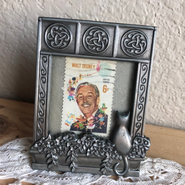 A Small/Miniature Picture Frame With A Design Of A Cat On A Window Seal Looking In And A 6 Cent Walt Disney Stamp Inside See Description