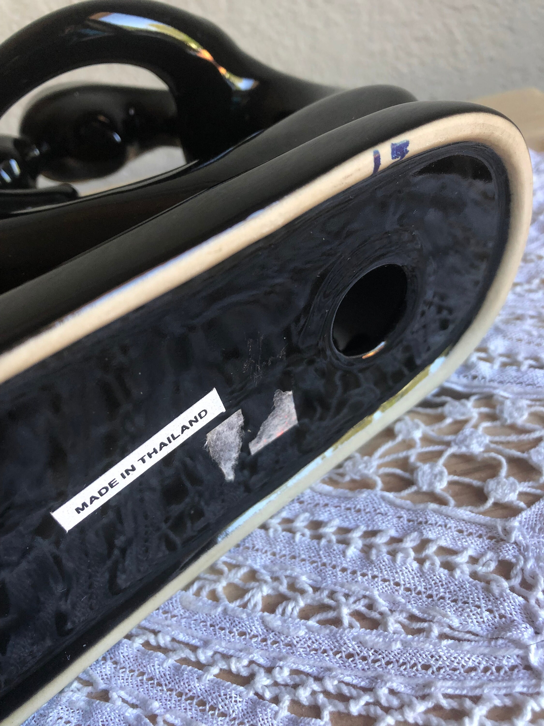 A Black Porcelain Figurine of A Woman With Child With Sticker Etsy