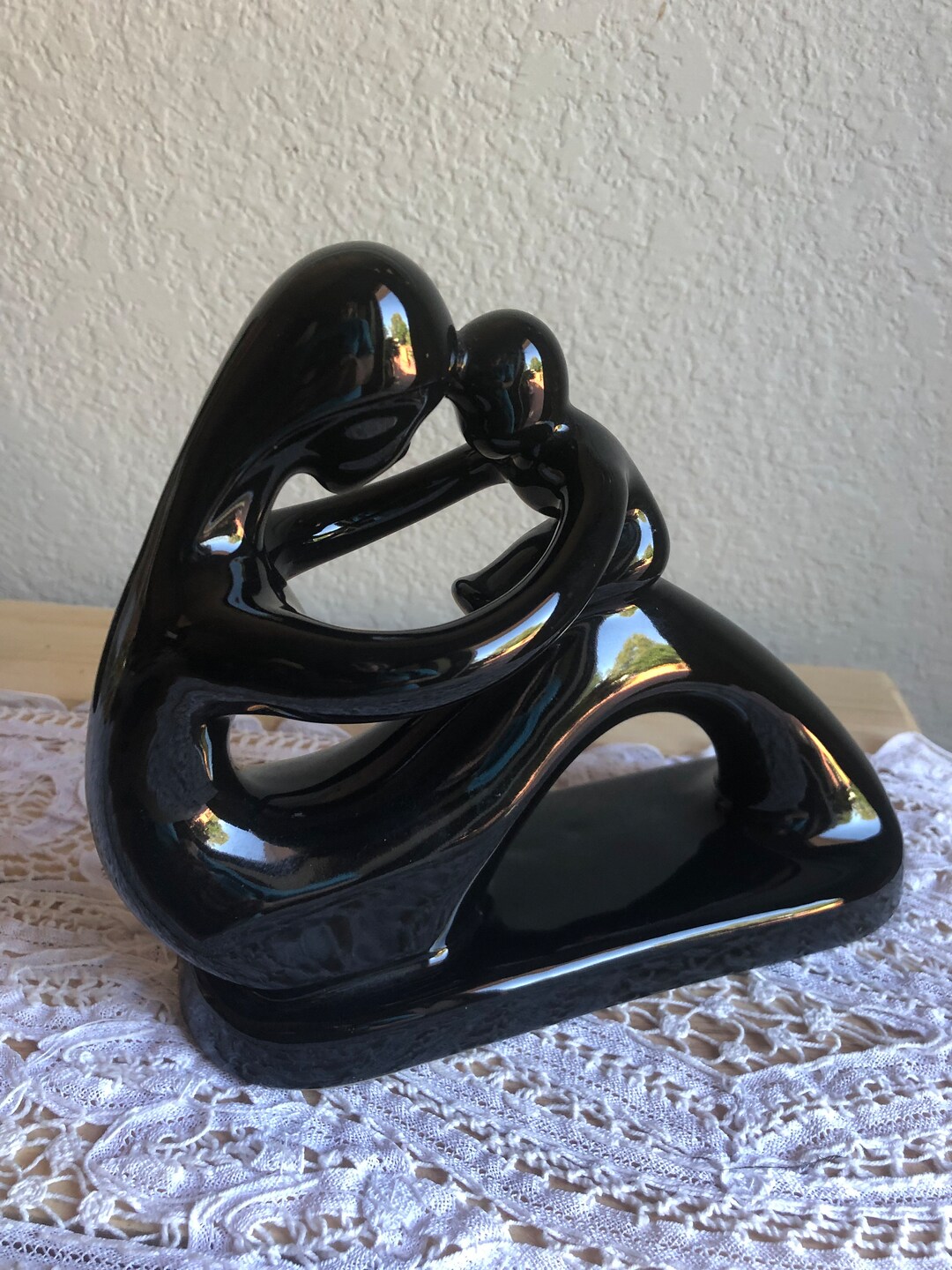 A Black Porcelain Figurine of A Woman With Child With Sticker Etsy