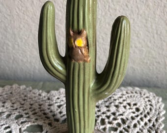 A Ceramic Figurine In The Shape Of A Sequoia Cactus With A Small Owl See Description