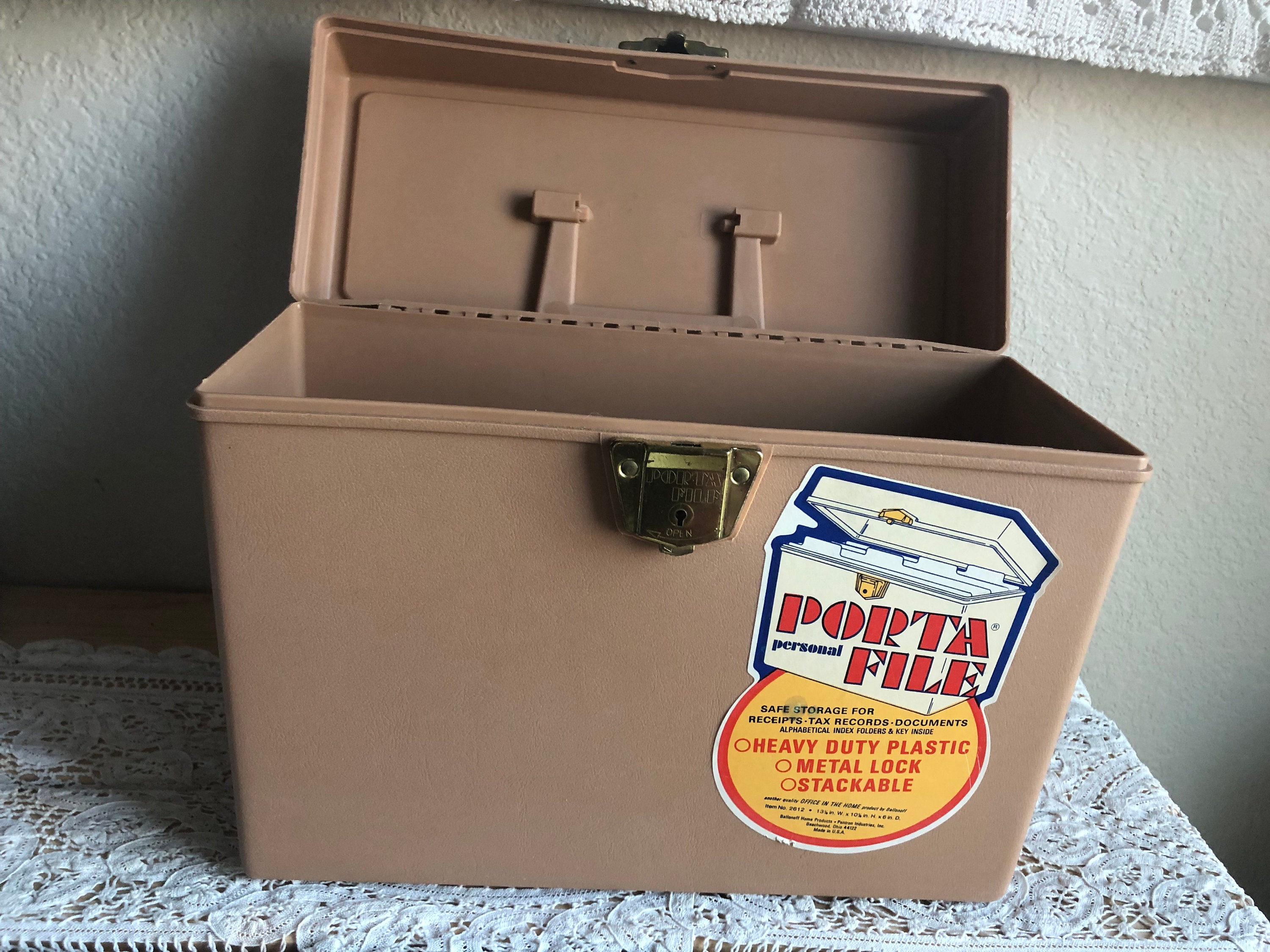 A Plastic Empty File Box That Has A Sticker That Reads Porta File 