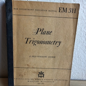 May include: A vintage book titled "Plane Trigonometry: A Self-Teaching Course" by the United States Armed Forces Institute in Madison, Wisconsin. The book cover is brown with black text and a black spine.