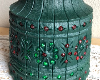 A Decorative Green Plastic Light Shade With A Red And Green Jeweled Pattern See Description