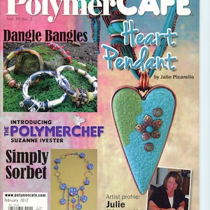 May include: Polymer Cafe magazine cover featuring a turquoise heart pendant with a green and brown flower design, a necklace with purple and blue beads, and a collection of colourful bangle bracelets. The magazine title is Polymer Cafe, and the issue is Vol. 10 No. 2. The cover also features the text "Dangle Bangles" and "Heart Pendant".