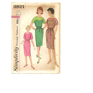 May include: Vintage Simplicity sewing pattern featuring three dress designs. The dresses are depicted in pink, green, and striped patterns. The pattern includes the number 3821, size 13, and bust 33. The price is 60c.