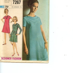 May include: Simplicity sewing pattern number 7267 for a sleeveless dress. The pattern is for a half-size, size 14 1/2, bust 35. The pattern shows a woman wearing a light blue dress with a scoop neck and a V-shaped yoke.