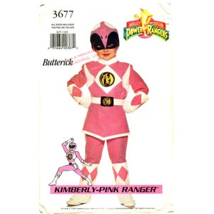 May include: A Butterick sewing pattern envelope for a Mighty Morphin Power Rangers Kimberly Pink Ranger costume. The package features a child wearing a pink and white jumpsuit with a black and pink helmet, a circular chest emblem, and white boots.