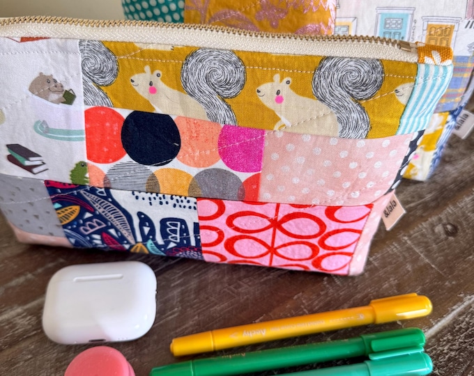 Handmade quilted zipper pouch; various patterns available, all unique