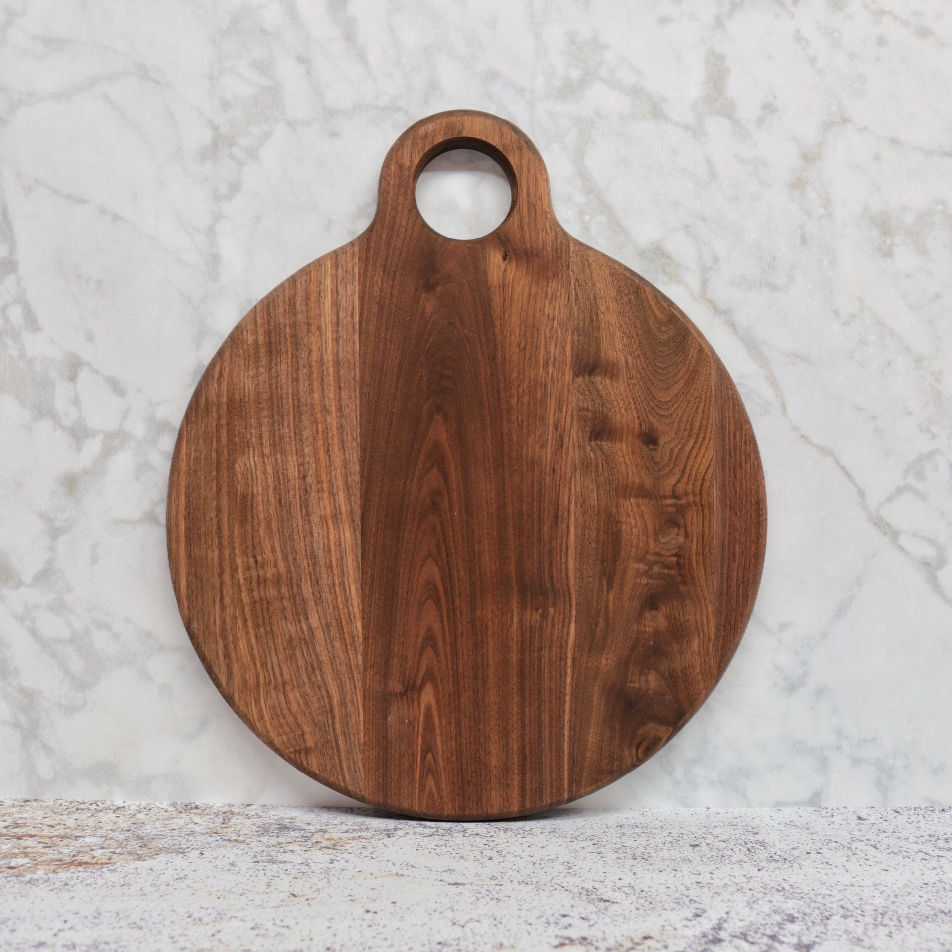 large circular wooden cutting board