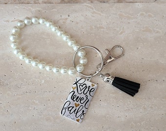 Pearl Bracelet Keychain - Metal Love Never Fails Charm - Silvertone Shaped Clasp & Keyring  - Black Tassel