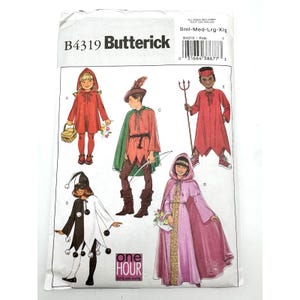 May include: A Butterick B4319 sewing pattern envelope for children's costumes. The front displays illustrations of five different outfits: a red hooded cape, a green and peach forest character, a red devil with a trident, a black and white jester, and a long purple hooded robe with gold trim.