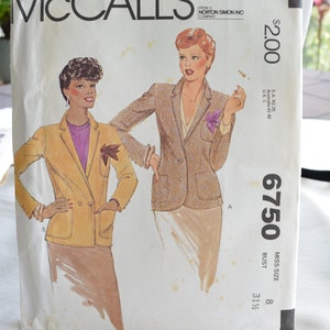 May include: McCall's sewing pattern number 6750 for a blazer. The pattern is for a miss size 8 with a bust measurement of 31 1/2 inches. The pattern shows two women wearing different versions of the blazer.
