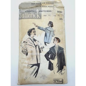May include: A vintage Butterick 8092 sewing pattern envelope featuring illustrations of a jacket in three variations. The text includes "PRINTED PATTERNS", "8092", "BUST 42", "SIZE 40", "65c", "MODERN SEWING IS EASY", and "magic to make". The paper is aged.
