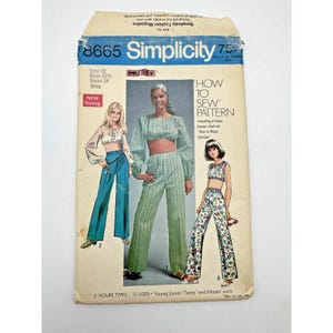 May include: Vintage Simplicity sewing pattern 8665. The pattern features illustrations of three different outfits: a crop top and pants set, and a floral pants set. The pattern includes sizing for Misses and Young Junior/Teens.
