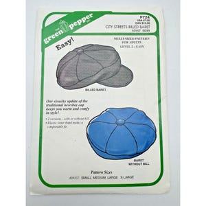 May include: A sewing pattern for a billed beret and a beret without a bill, with the text "Easy!" and "City Streets Billed Beret" on the cover. The pattern includes adult sizes and features two versions of the hat.