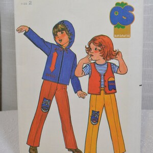 May include: A vintage sewing pattern for children's clothing. The pattern is for a blue jacket with a red stripe and a red vest with a blue stripe. The pattern is from Quick & Easy Butterick and is size 2. The pattern number is 6722 and the price is $1.75.