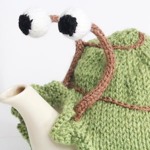 Green snail tea cosy with frilly bottom. Gift for tea lovers. Garden lovers gift image 4