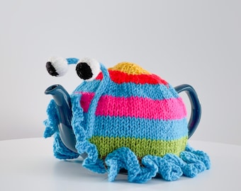 Knitted blue stripy frilly snail tea cosie by Ruperts House. Tea lovers teatime treat.